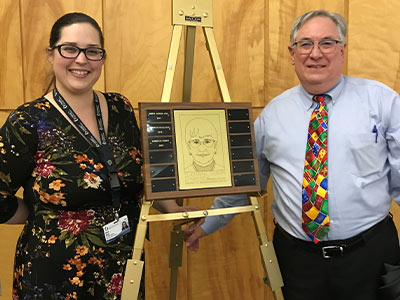 Christi Hardy, left, is the latest Joanne Olson Award winner in the Office of Academic Affairs, which is led by Dr. Ralph Didlake, right.